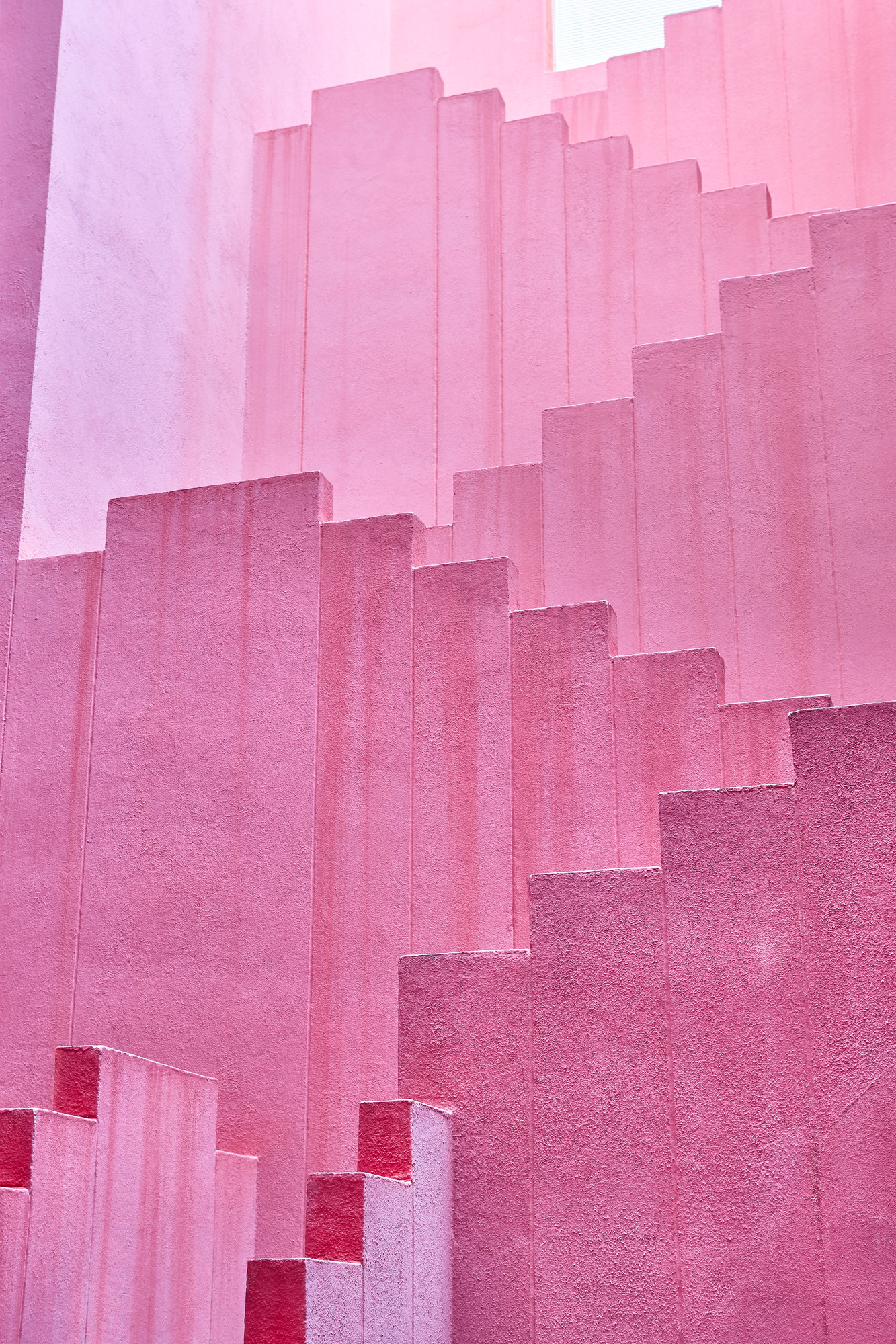 Geometric building structure in pink tone. Alicante, Spain